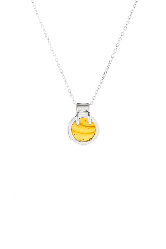 Architectural 925 sterling silver pool-shaped pendant featuring a round yellow amber gemstone with a chain.