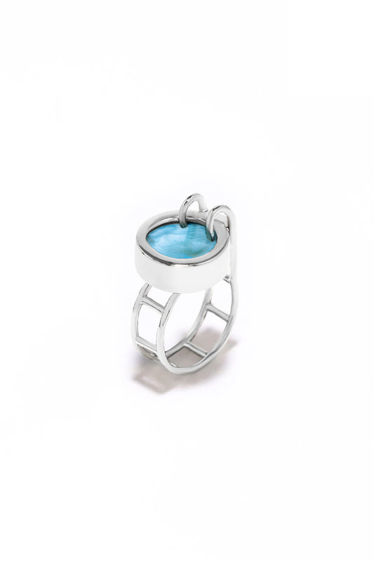 Architectural 925 sterling silver pool-shaped ring featuring a round blue Dominican Larimar gemstone with an adjustable wide band.